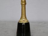 a bottle of champagne sitting on a marble table