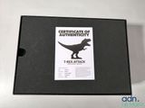 an image of a box containing a certificate of authenticity for a t - rex attack