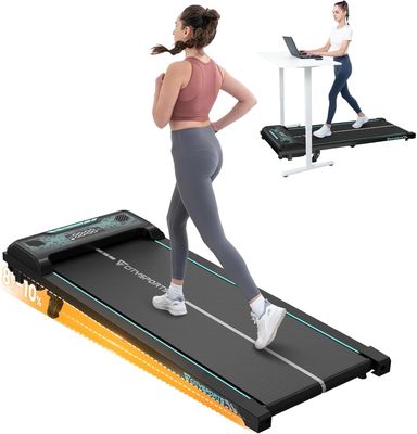 woman running on a treadmill with a laptop on a desk