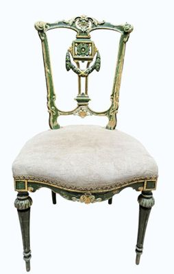 an image of a green and gold chair with a white seat