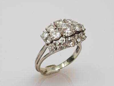 an 18k white gold diamond cluster ring
