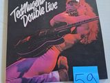 a poster of a man playing a guitar on the wall