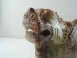 a figurine of a dog with a mouth open