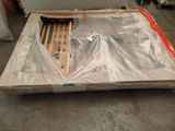 a bed that has been wrapped up and is in the process of being shipped
