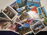 a lot of postcards that are on the table