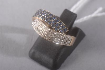 an image of a ring with blue and white diamonds