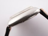a close up of a metal object on a white surface