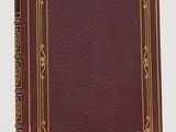 a red book with gold trim and a gold border on it