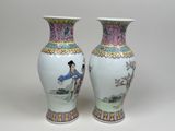 pair of chinese vases with a woman and a child on them