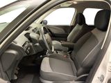 the interior of a car with the door open showing the driver ' s seats