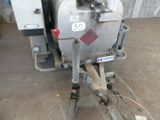 an image of a machine that is sitting in a garage