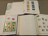 a lot of stamps on the pages of a book