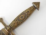 a close up of a knife on a white surface