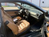 the interior of a car with the door open and the driver ' s seat up