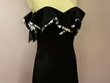 a black dress on a mannequin on a mannequin stand