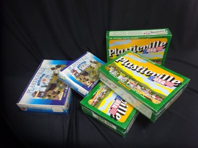 three boxes of cigarettes are sitting on a black surface
