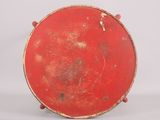 a red plate that is sitting on a white surface