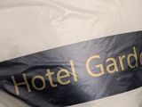 a black and white ribbon that says hotel garden on it