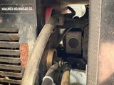 a close up of a machine with a hose attached to it