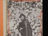 a book with a picture of a man standing in front of a pile of birds