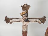 a statue of jesus on the cross with a crown on his head