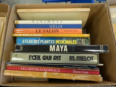 many books in a box that are stacked together
