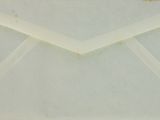 an envelope with a white ribbon and a white envelope with a white envelope and a white envelope with a white envelope and a white envelope with a white envelope