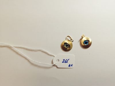 a close up of a tag with a pair of earrings on it