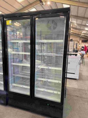 two refrigerators that are sitting in the middle of a store