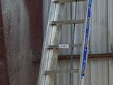 a ladder that is leaning against a wall in a room