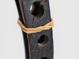 a wooden sculpture of a horse with a rope around it ' s neck