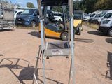 an image of a forklift parked in a parking lot