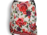 un chemisier pour femme avec un imprimé floral sur le devant et des rayures rouges et blanches dans le bas
