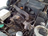 a picture of a car engine with the hood open