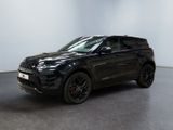 un Range Rover noir garé dans une grande pièce