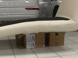 a chair that is sitting on a box in front of a car