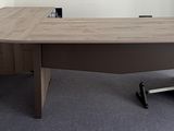 an image of a desk in an office with a phone on it