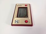 a small electronic device sitting on a white surface