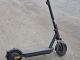 a scooter that is sitting on the pavement