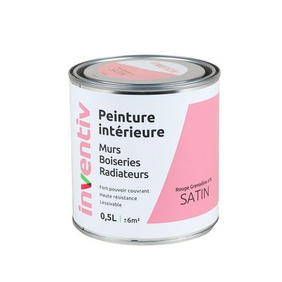 le pot de peinture est rose et blanc sur fond blanc