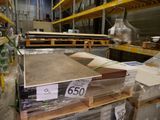 a large pile of boxes on a shelf in a warehouse