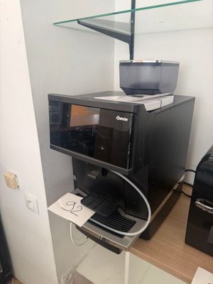 a microwave and a printer on a shelf in a room