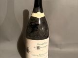a bottle of wine that is sitting on a table