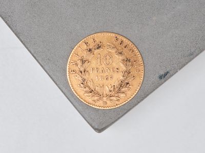 an image of a gold coin on top of a piece of paper
