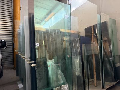many glass doors in a building that are being built