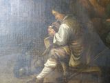 un tableau représentant un homme assis sur un banc avec un chien