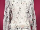 an image of a white jacket on a mannequin mannequin