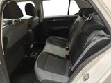 the back seats of a white car with black trims and a black seat belt