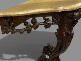 a gold table with a marble top on a gray background