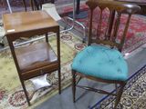 two chairs and a table in a room with rugs
